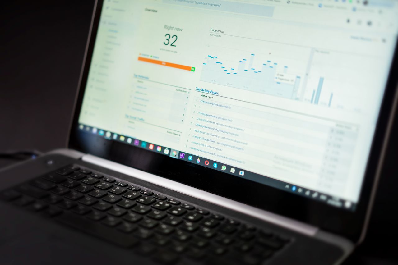 services-06 A laptop displaying an analytics dashboard with real-time data tracking and analysis tools.
